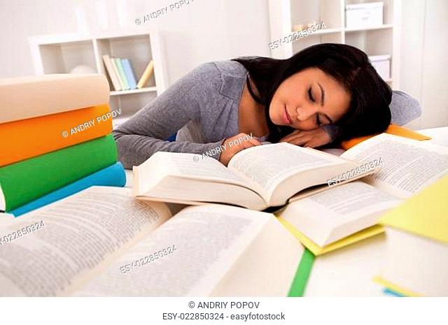 Young Woman Sleeping While Studying