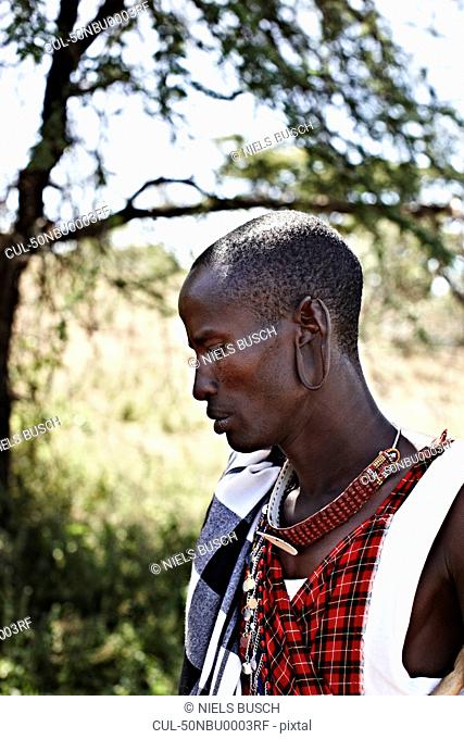 Maasai man standing outdoors