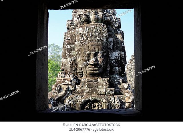 Enigmatic Lokesvara stone faces on the towers of the Bayon temple, Angkor Thom. Cambodia, Siem Reap, Angkor