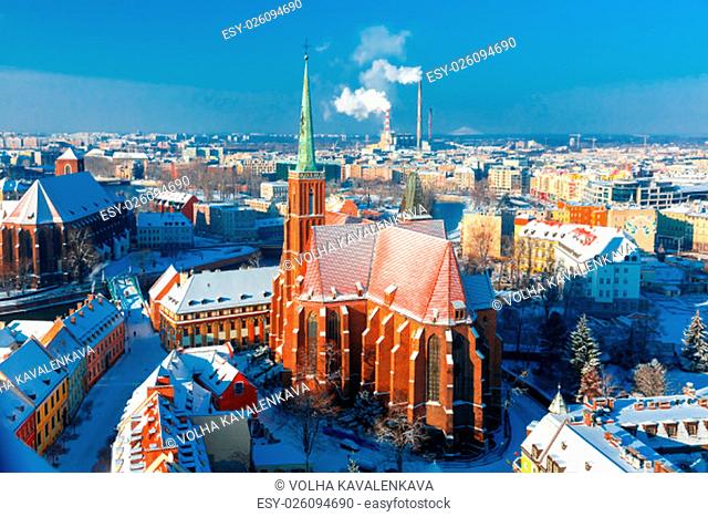 Aerial view of Ostrow Tumski with church of the Holy Cross and St. Bartholomew from Cathedral of St. John in the winter morning in Wroclaw, Poland