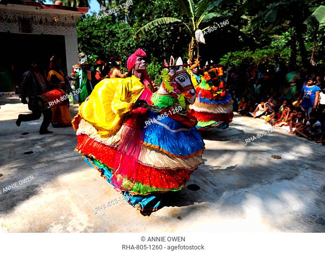 Main character Rautani performing traditional Chaiti Ghoda (Dummy Horse) dance at village event, Odisha, India, Asia