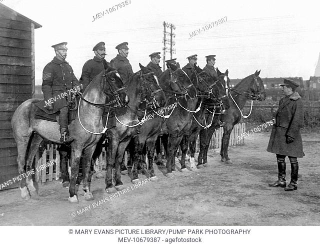 An APM (Assistant Provost Marshal) giving orders to mounted police just behind the line on the Western Front in France during World War One