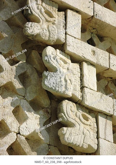 Close-up of sculptures on a stone wall, Nunnery Quadrangle, Uxmal, Yucatan, Mexico