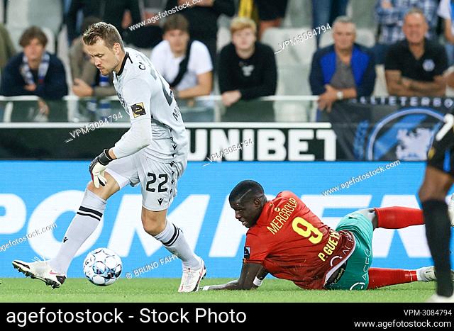 Club's goalkeeper Simon Mignolet and Oostende's Makhtar Gueye fight for the ball during a soccer match between Club Brugge KV and KV Oostende