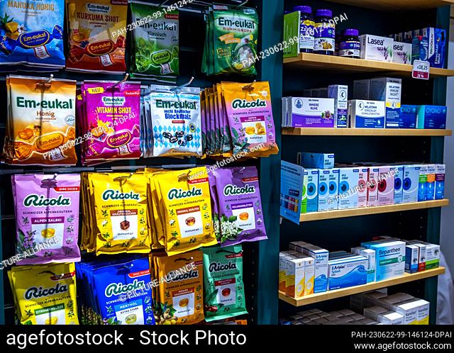 PRODUCTION - 30 May 2023, Mecklenburg-Western Pomerania, Schwerin: Dietary supplements and cosmetics are on a display shelf in the Rainbow Pharmacy
