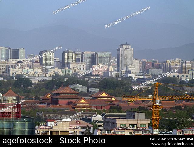 14 April 2023, China, Peking: The Xishan Mountains (West Mountains) can be seen to the west behind the residential buildings on the Second Ring Road