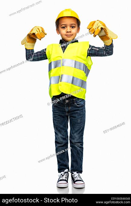 little boy in gloves, safety vest and helmet