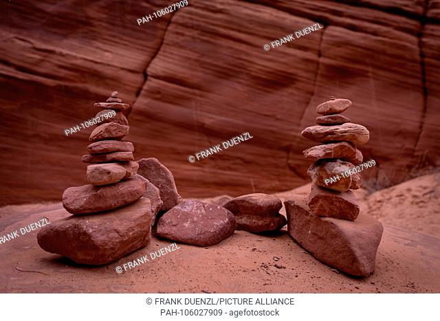 Mystical rocks on Navajo land at Canyon X stacked by esoteric tourists, in April 2018. | usage worldwide. - Page/Arizona/United States of America