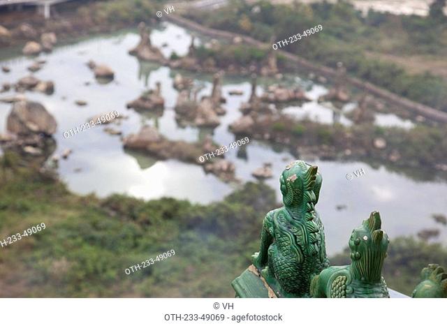 Overlooking the ornamented rock garden from the pagoda, a buddhist temple in Shantou, China
