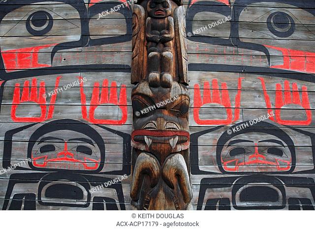 Detail of totem pole and longhouse, Ksan Historical Village and Museum, Hazelton, British Columbia, Canada