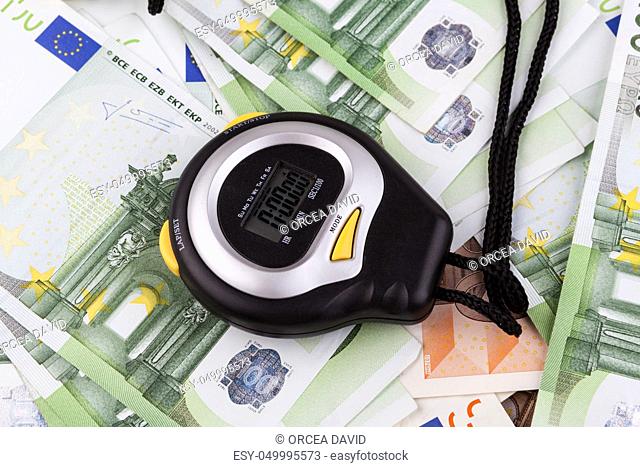 Black Digital stopwatch on various euro banknotes