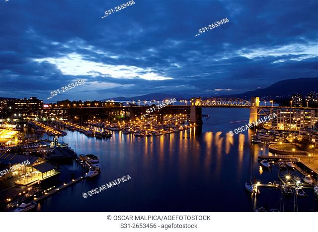 night view of the Burrard Bridge, Yaletown and Granville Island from the Cambie Street Bridge in Vancouver Canada