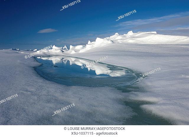 meltwater pool in the spring on the sea ice at Admiralty Inlet, near Arctic Bay Nunavut, Canada