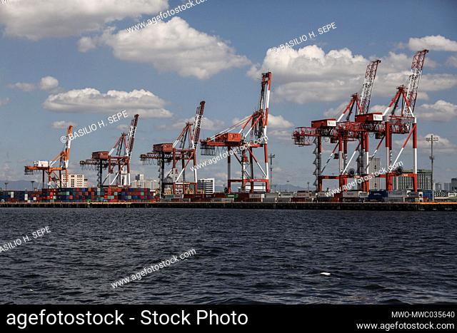 Cranes are seen from the port. The Philippine economy plunged into recession in its second quarter while the country grapples with surging coronavirus...