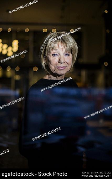 PRODUCTION - 18 December 2023, Berlin: Judy Winter, actress, stands at the window of a Charlottenburg café at the end of an interview with the Deutsche...
