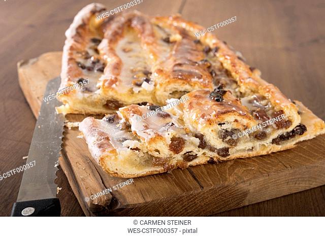 Sliced Danish pastry with marzipan on wooden board