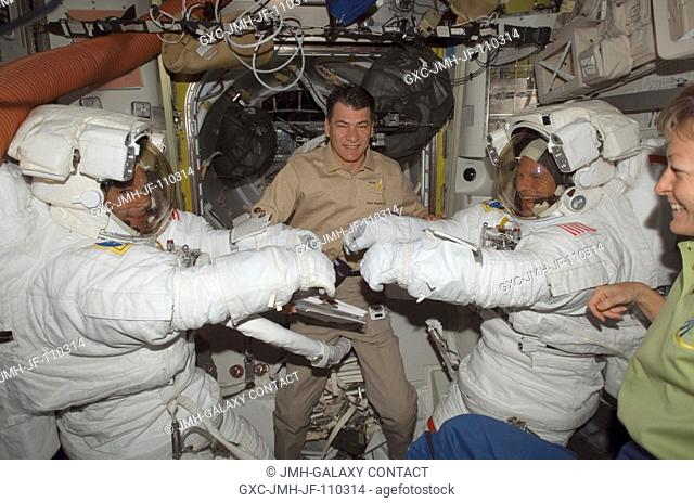 Attired in their Extravehicular Mobility Unit (EMU) spacesuits, astronauts Doug Wheelock (left) and Scott Parazynski, STS-120 mission specialists