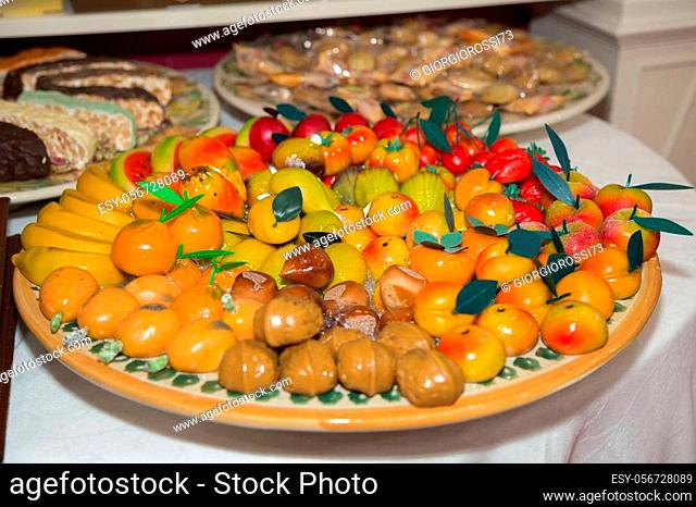 Small Marzipan Sweets in the Shape of Fruit Arranged on a Round Plate