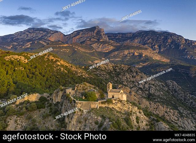 Aerial view of the Serra de Aubenç range and the hermitage of Castell-llebre at sunrise (Peramola, Alt Urgell, Catalonia, Spain, Pyrenees)