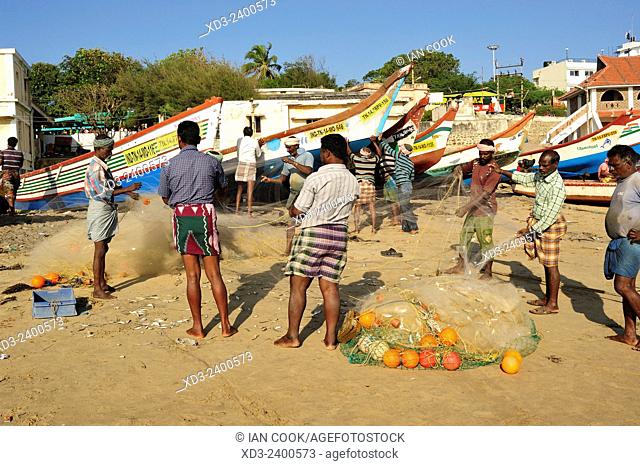men sorting a fishing net, Kanyakumari, Tamil Nadu, India