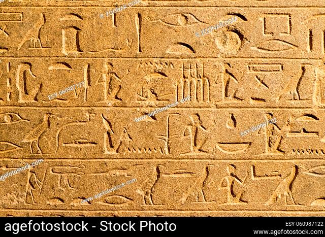 big sand wall with fragment of Ancient Egyptian document