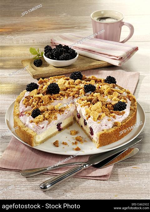 Double cream cheesecake with blackberries and a crumble topping