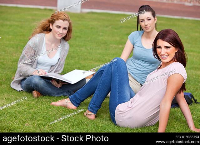 Young women sitting on the lawn