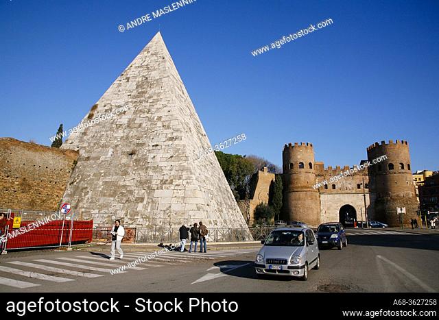 Caius Cestius pyramid in Rome at Piazzale Ostiense. Built 12 BC during the Roman Empire. 36 meters tall. Porta San Paolo in the background