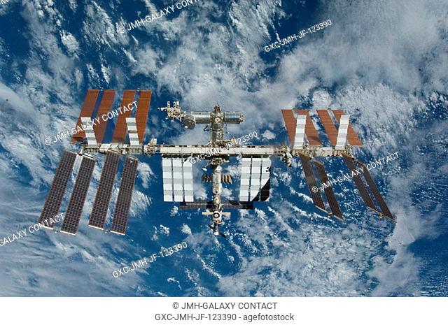 The International Space Station is featured in this image photographed by an STS-132 crew member on space shuttle Atlantis after the station and shuttle began...
