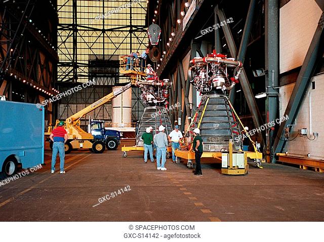 12/08/1999 -- Workers in the Vehicle Assembly Building move orbiter Endeavour's main engine No. 3 in front out of the way before moving the replacement engine...