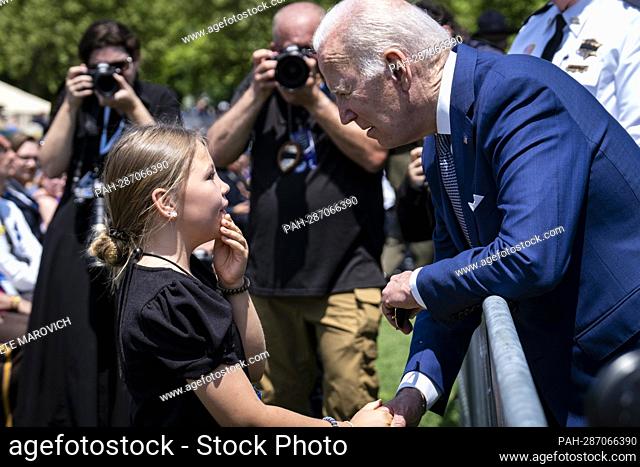 United States President Joe Biden speaks with with Jovi Kate Humphrey, 9, granddaughter of fallen law enforcement officer Wendell Humphrey of Baldwin County