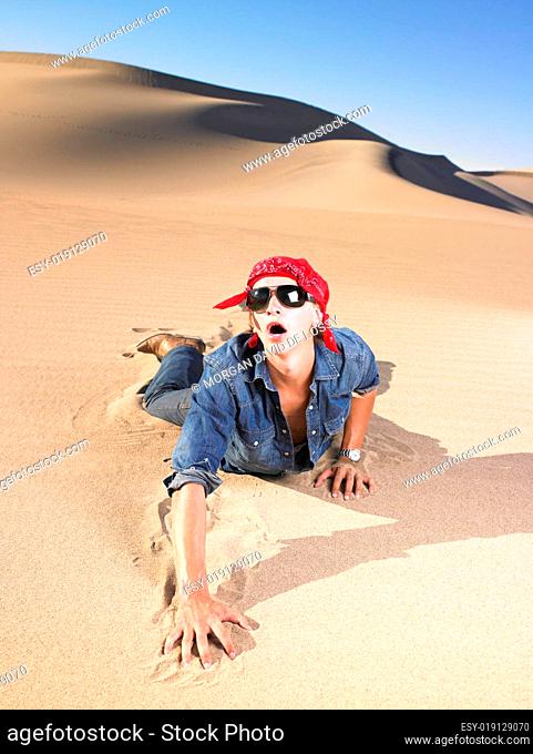 Thirsty man crawling through the desert Stock Photos and Images |  agefotostock