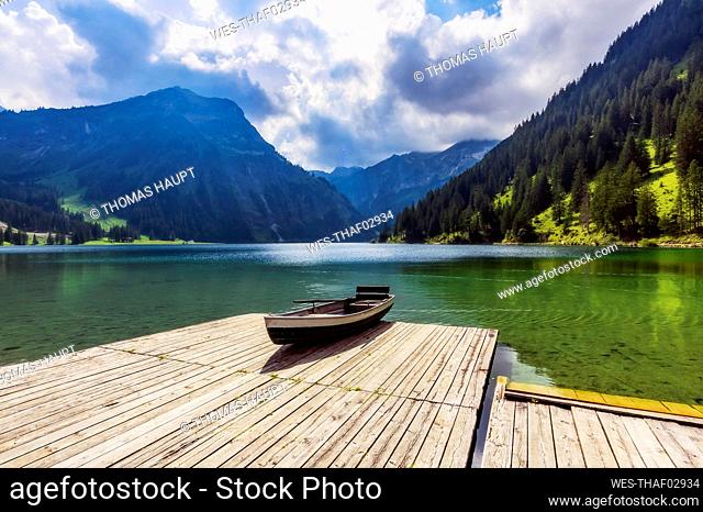 Rowboat left at edge of jetty on shore of Vilsalpsee lake