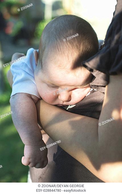 Baby in his mother's arms