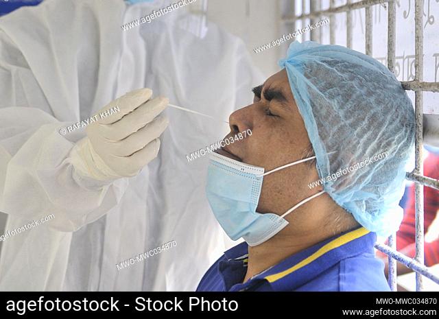 A medical officer wearing a protective kit is collecting samples for COVID-19 ANTIGEN testing at Shahid Shamsuddin Ahmed Hospital. Sylhet, Bangladesh