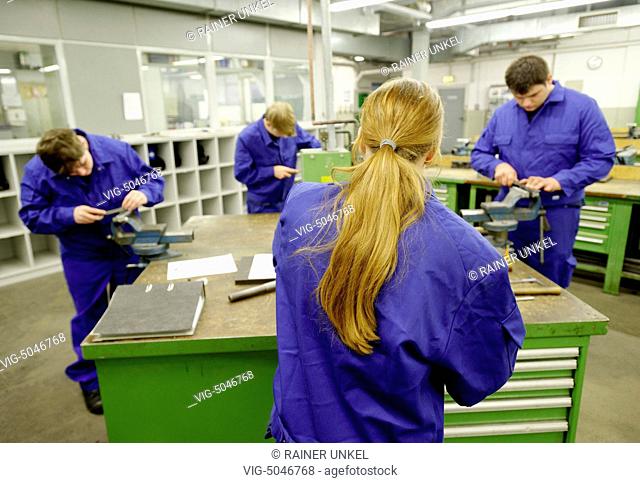 GERMANY, MOERS, 12.11.2014, DEU , GERMANY : Apprentices in the profession metal worker are working on rehearsal pieces in the CJD training centre in Moers -...
