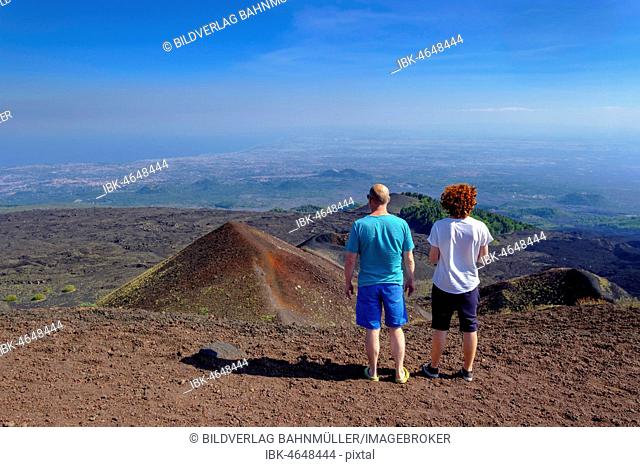 View, hikers on their way to the crater Silvestri, volcano Etna, province Catania, Silzilia, Italy