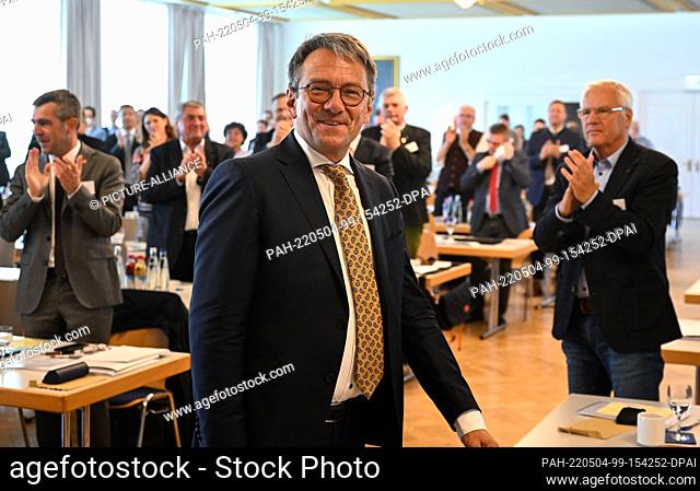04 May 2022, Bavaria, Prien Am Chiemsee: Thomas Karmasin (M, CSU), new president of the Bavarian County Association, is happy during the meeting after his...