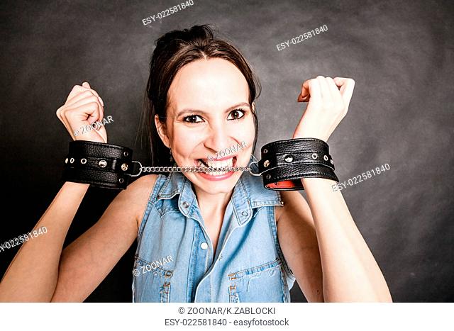 Arrest and jail. Criminal woman prisoner girl in handcuffs