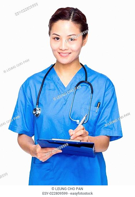 Doctor woman write on clipboard