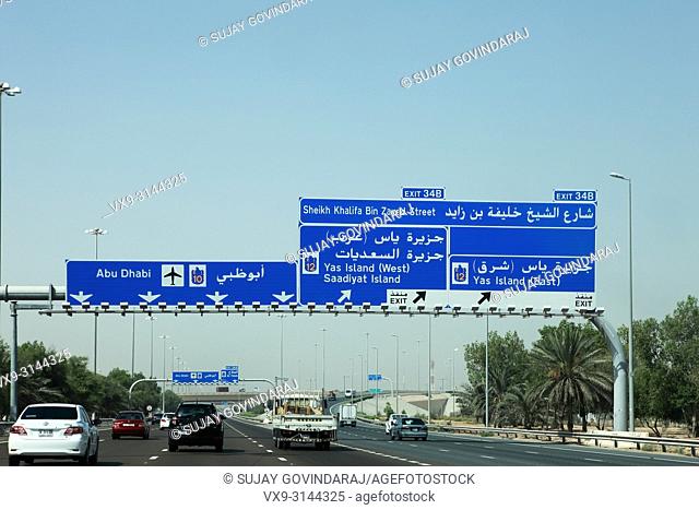 Abu Dhabi, UAE - June 06, 2012: Traffic moves along the Dubai-Abu Dhabi highway. In view is the 6 lane cariageway to Abu Dhabi