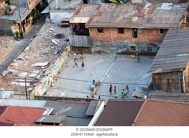 Kids are playing games in slums of Jakarta