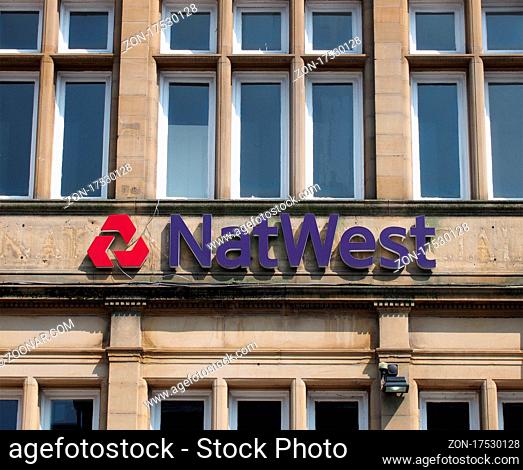 brighouse, west yorkshire, united kingdom - 21 july 2021: brighouse, west yorkshire, united kingdom view of the front of a natwest bank with sign and logo in...