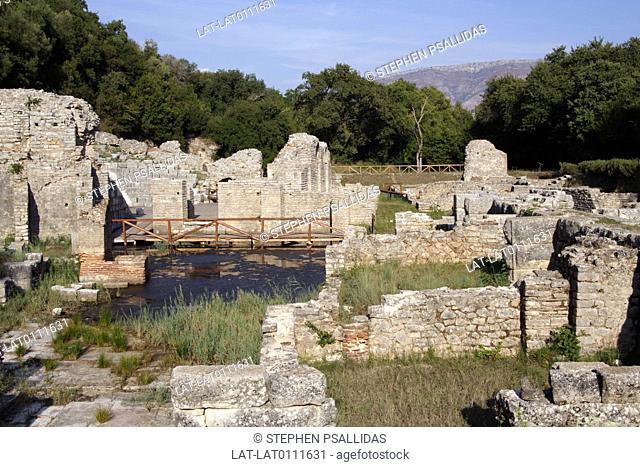 UNESCO World Heritage Site. Archaeological site. Amphitheatre complex. Roman. Walls. Arches. Water. Woods