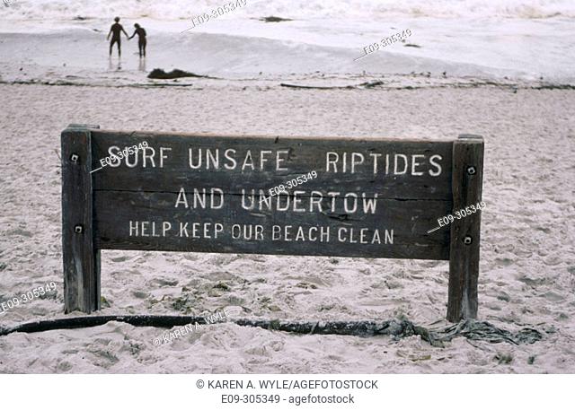 'Surf Unsafe Riptides' sign on beach, Carmel, California, USA