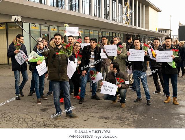 A group of Syrian refufess pose for a self portrait with a Selfie-Stick in front of the central train station in Wuerzburg, Germany, 16 January 2016