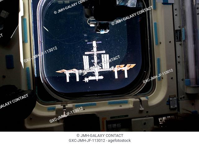 The International Space Station is featured in this image photographed by an STS-134 crew member at an aft flight deck window of space shuttle Endeavour during...