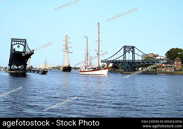 30 September 2023, Lower Saxony, Wilhelmshaven: The sailing ships sail out for a regatta as part of the 21st Wilhelmshaven Sailing-CUP