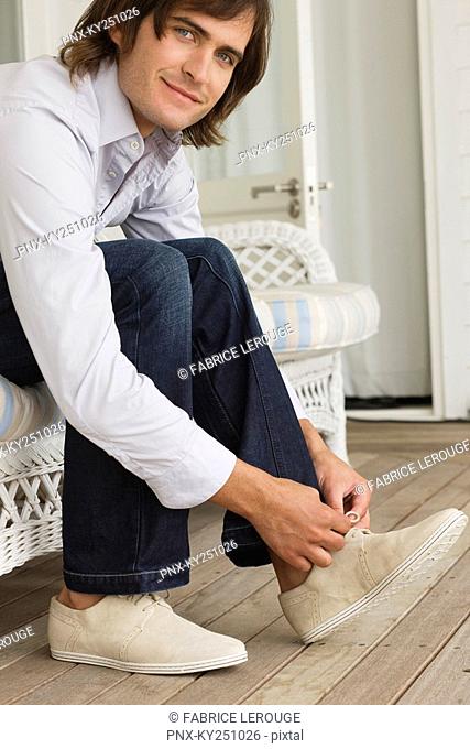 Man tying his shoelaces