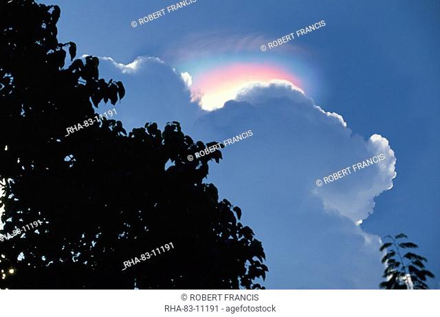 Rainbow atmospheric effect above cloud above the Ijen Plateau, Java, Indonesia, Southeast Asia, Asia